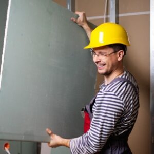 smiling expert painter sydney holding board of metal